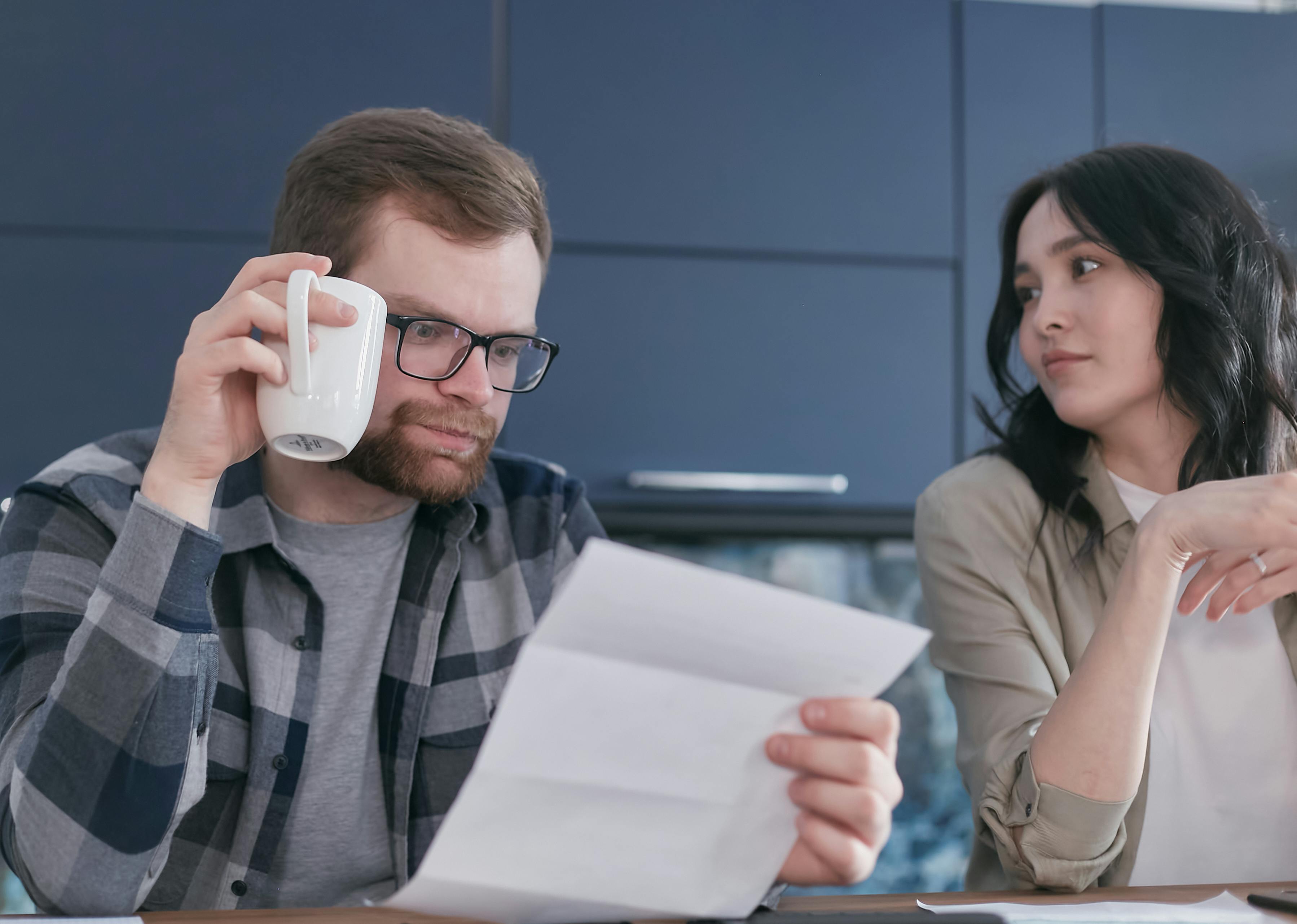 concerned couple reading city water notice